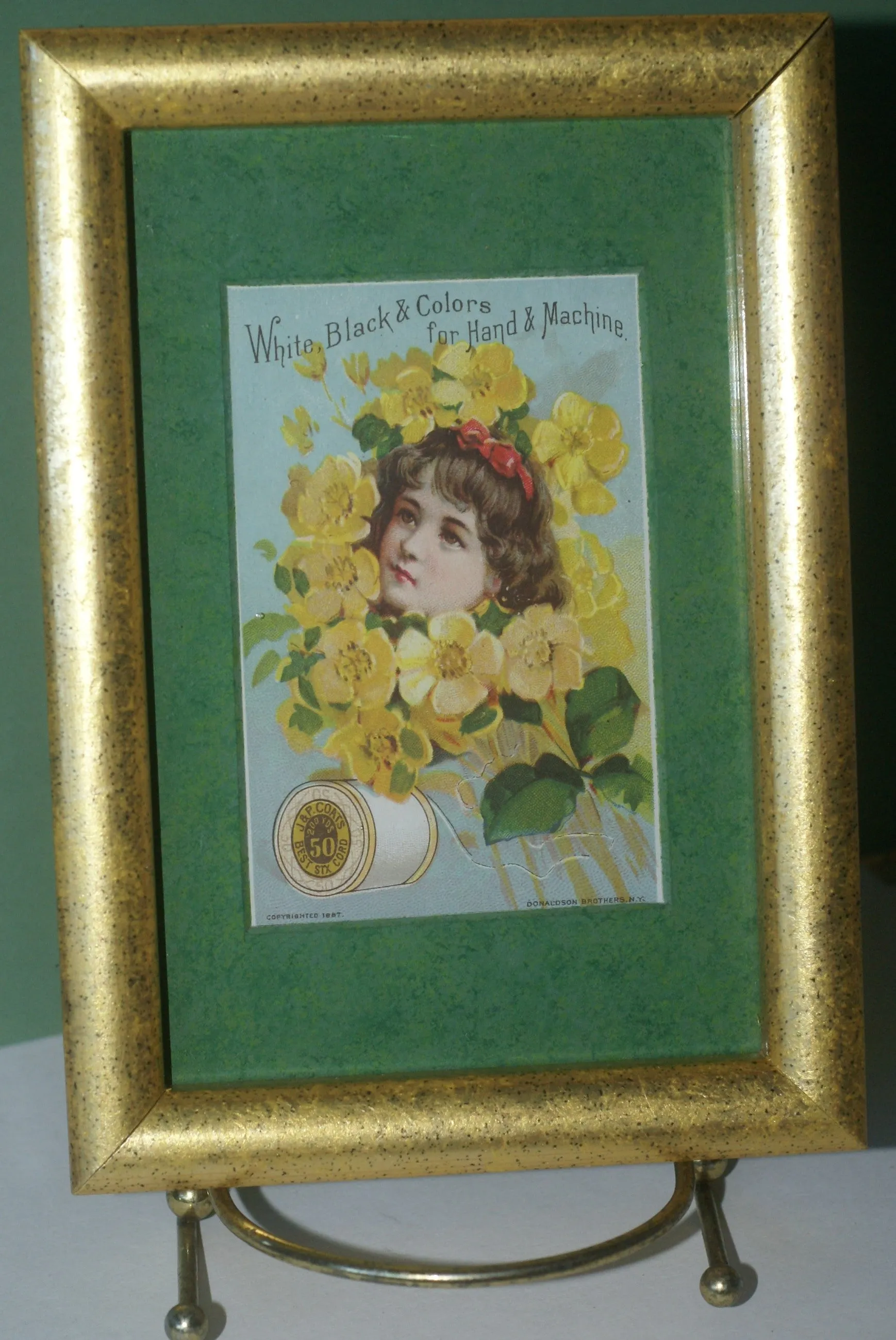 EPHEMERA AMERICANA WHIMSICAL ART: 1887 MATTED FRAMED WITH STAND, ANTIQUE AD VICTORIAN ADVERTISING TRADE CARD: J.& P. Coats GIRL YELLOW BOUQUET (DFPO1X) DESIGNER COLLECTOR COLLECTIBLE DELIGHTFUL WALL DÉCOR